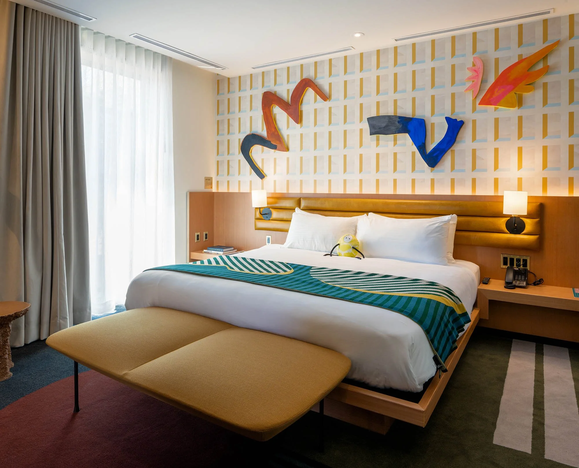 Modern, colourful bedroom at the Drake Hotel.