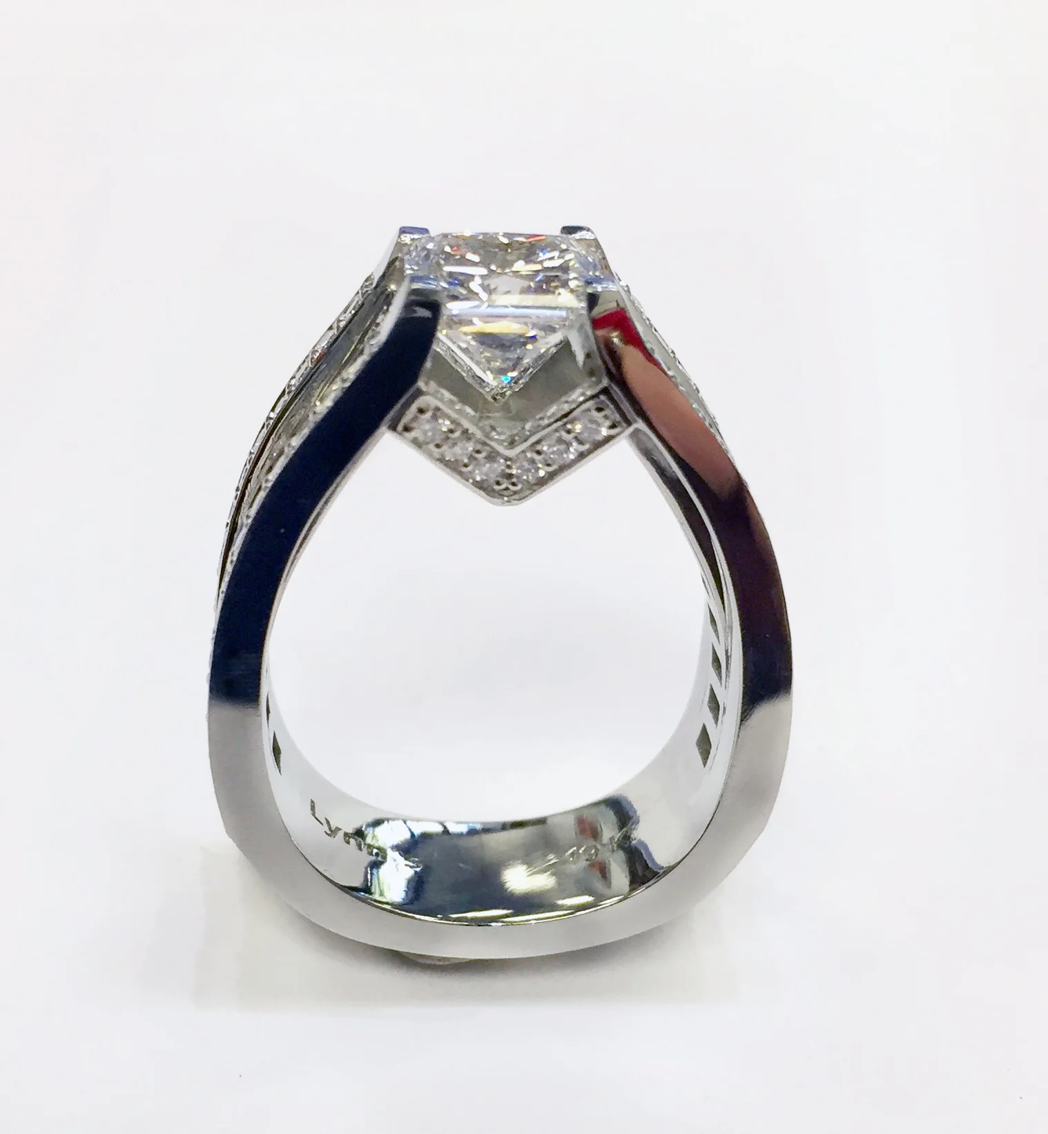 Lynn’s Custom, 19k white gold, 1.69ct radiant cut diamond, 1.14ctw baguette diamonds, .70ctw ideal cut diamonds RD-120