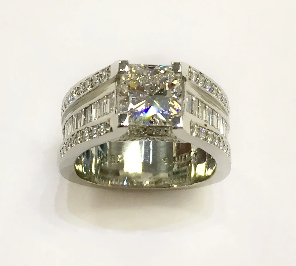 Lynn’s Custom, 19k white gold, 1.69ct radiant cut diamond, 1.14ctw baguette diamonds, .70ctw ideal cut diamonds RD-120