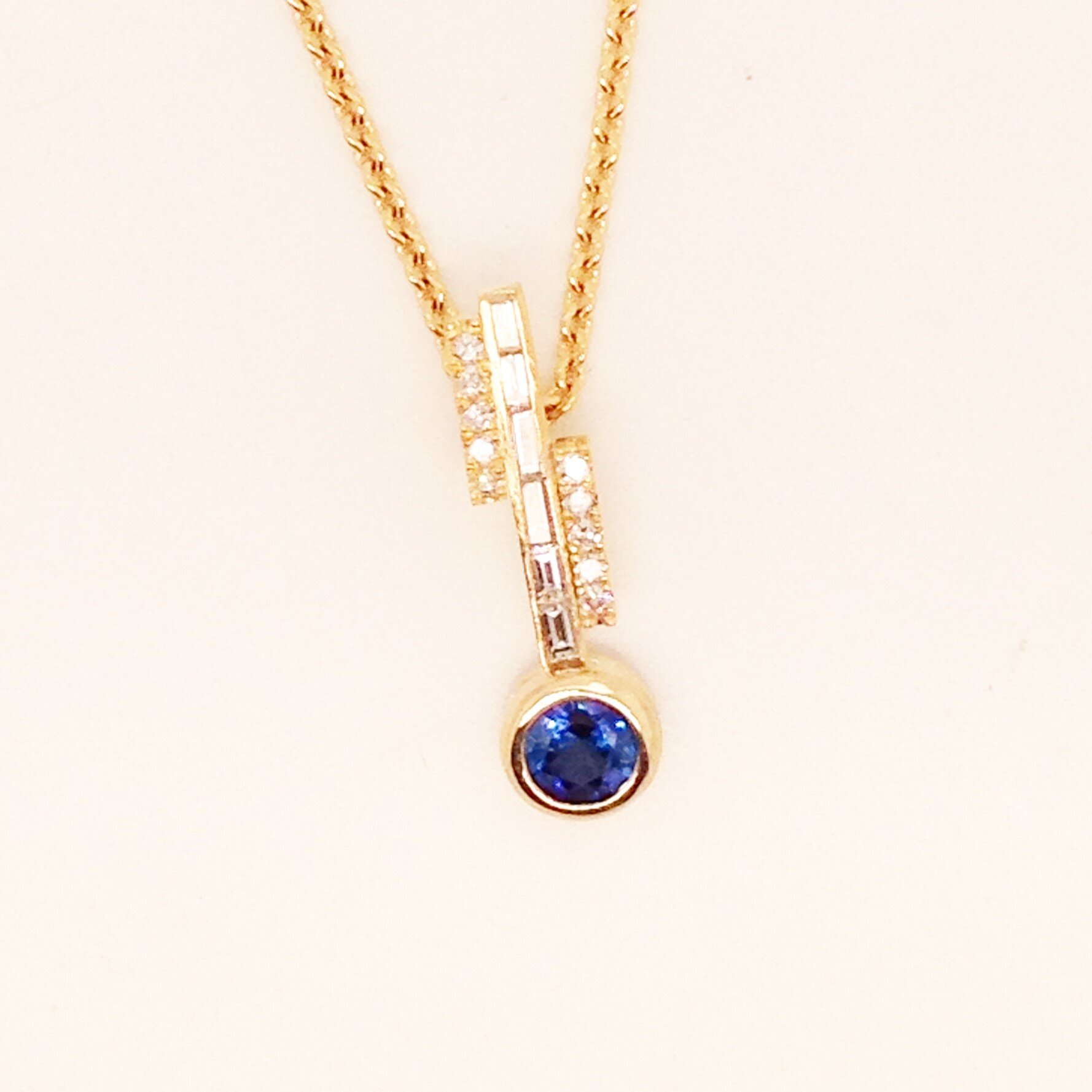 custom blue sapphire bezel and diamond pendant