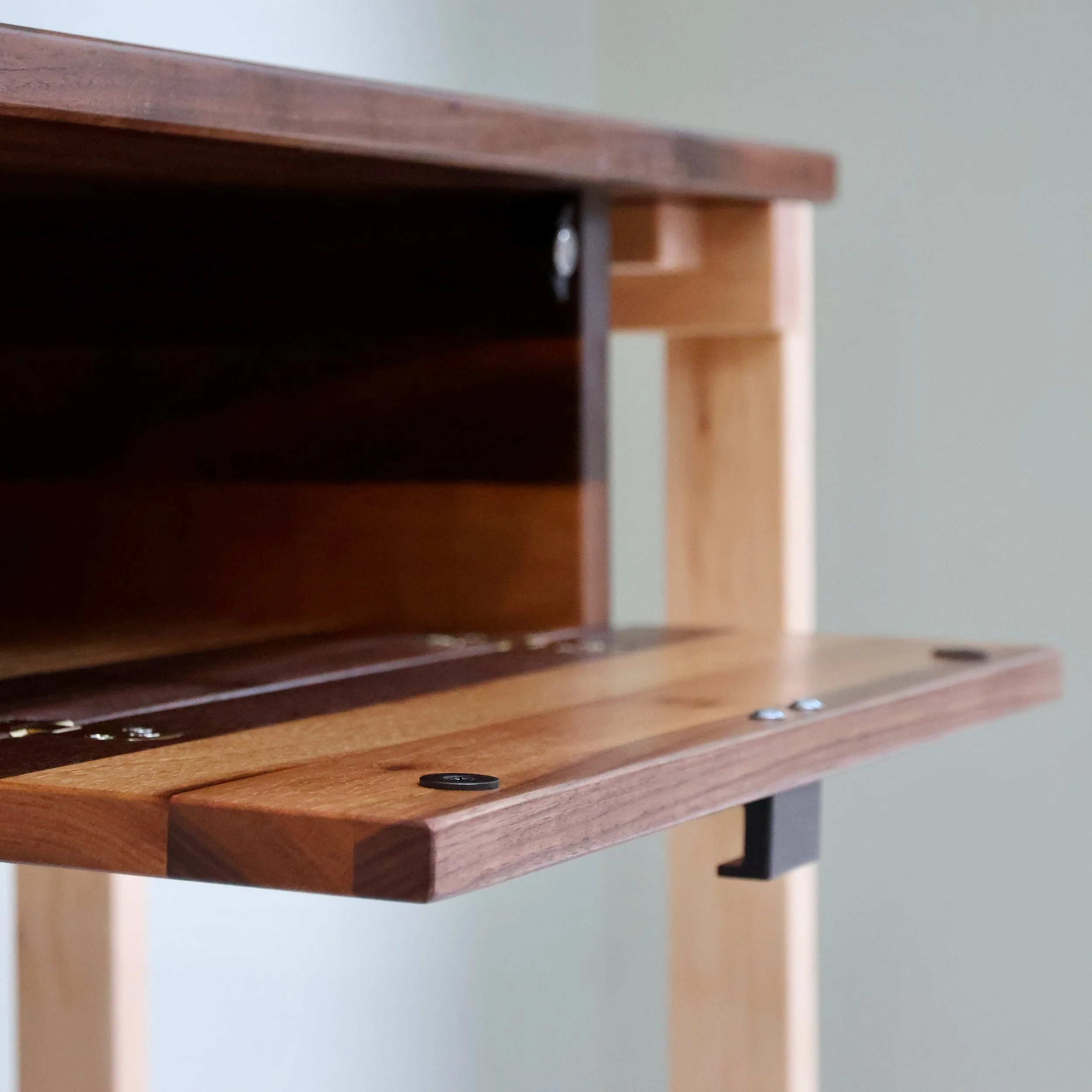 Bespoke walnut and maple console table with discreet storage draw