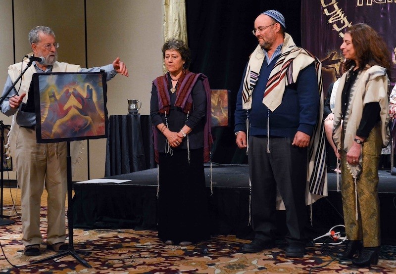 Rabbi Daniel Siegel ordains three new dayanim at the OHALAH 2017 conference. Left to right: Rabbi Daniel Siegel, Rabbi Sara Leya Schley (California, USA), Rabbi Simcha Daniel Burstyn (Kibbutz Lotan, Israel), and Rabbi Hannah Dresner (British Columbia, Canada).