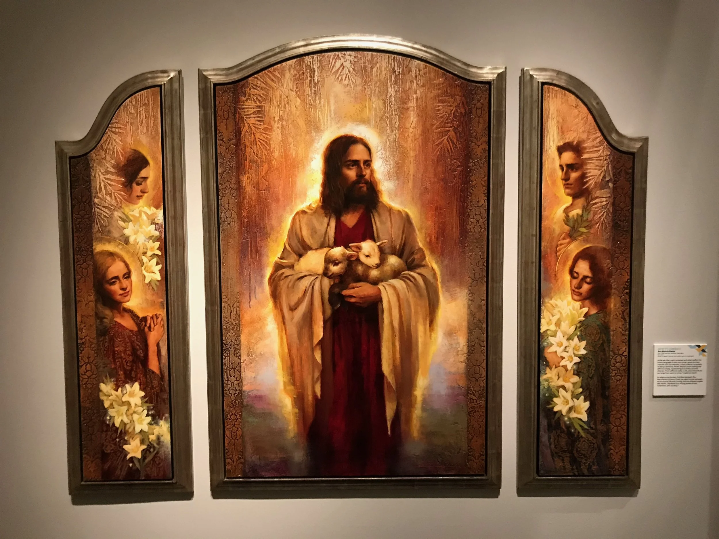 Mercy’s Embrace by Annie Henrie Nader. Acrylic, oil, gesso, charcoal, and metallic paint on wood panel.