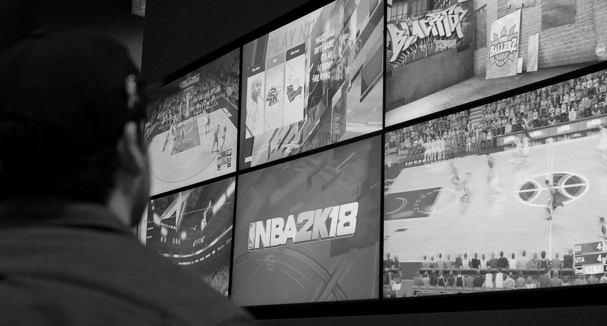 Black and White close up of games on media wall