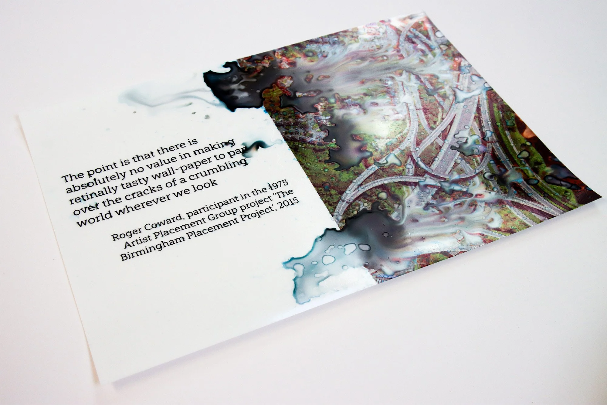 Open spread showing a Roger Coward quotation beside a water-distorted aerial image of a road interchange.