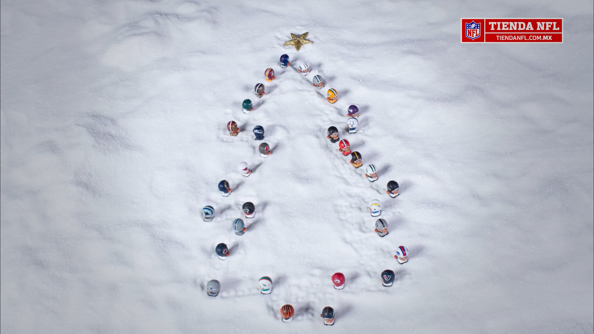 The NFL toys make a Christmas tree in the snow.