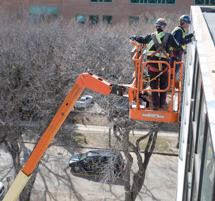 Professional roofer reading instructions