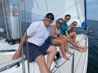 Family and friends enjoying a weekend day on a Chesapeake Bay half day sailing trip.