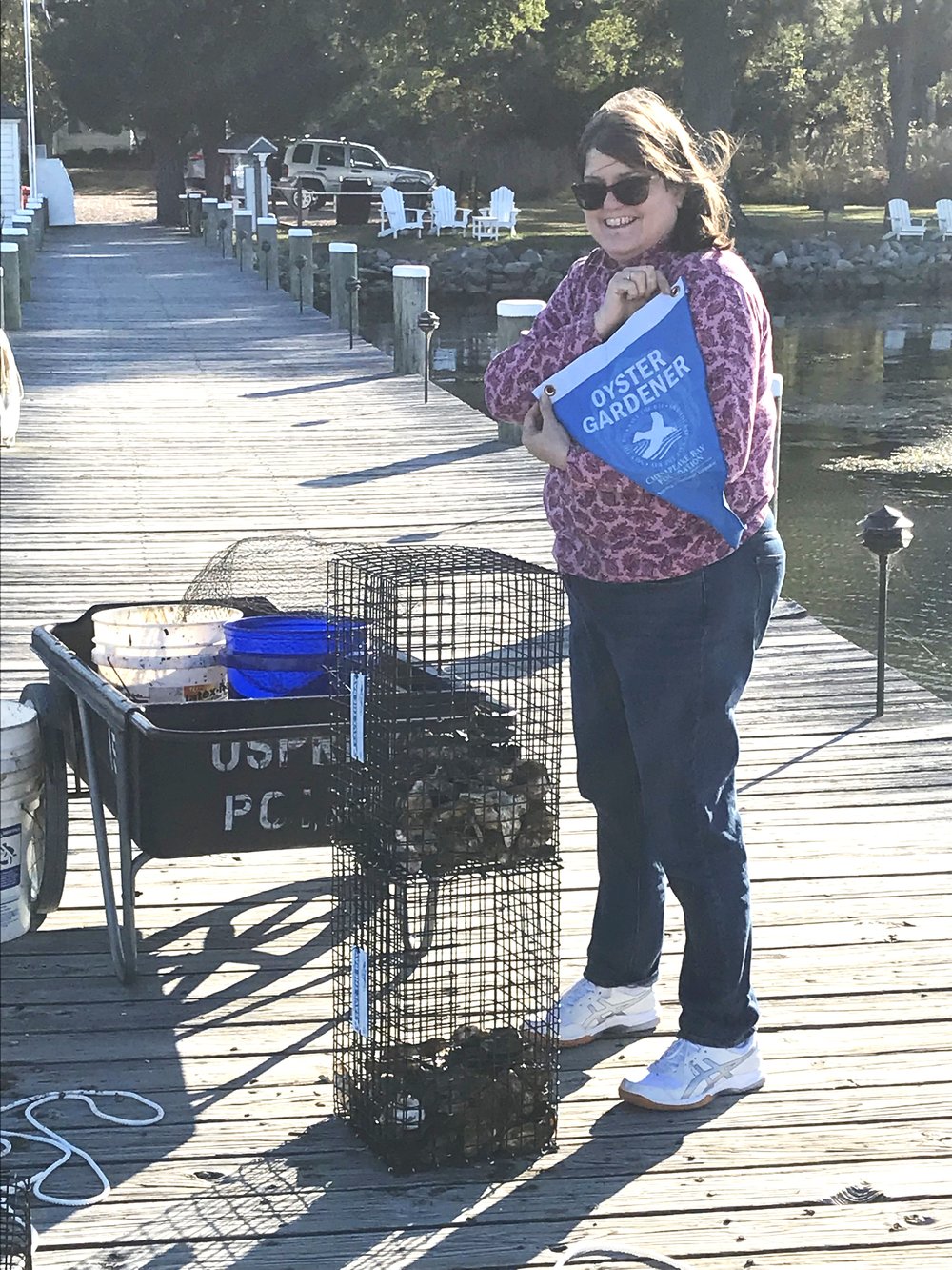 Kathy planting Oysters.jpg