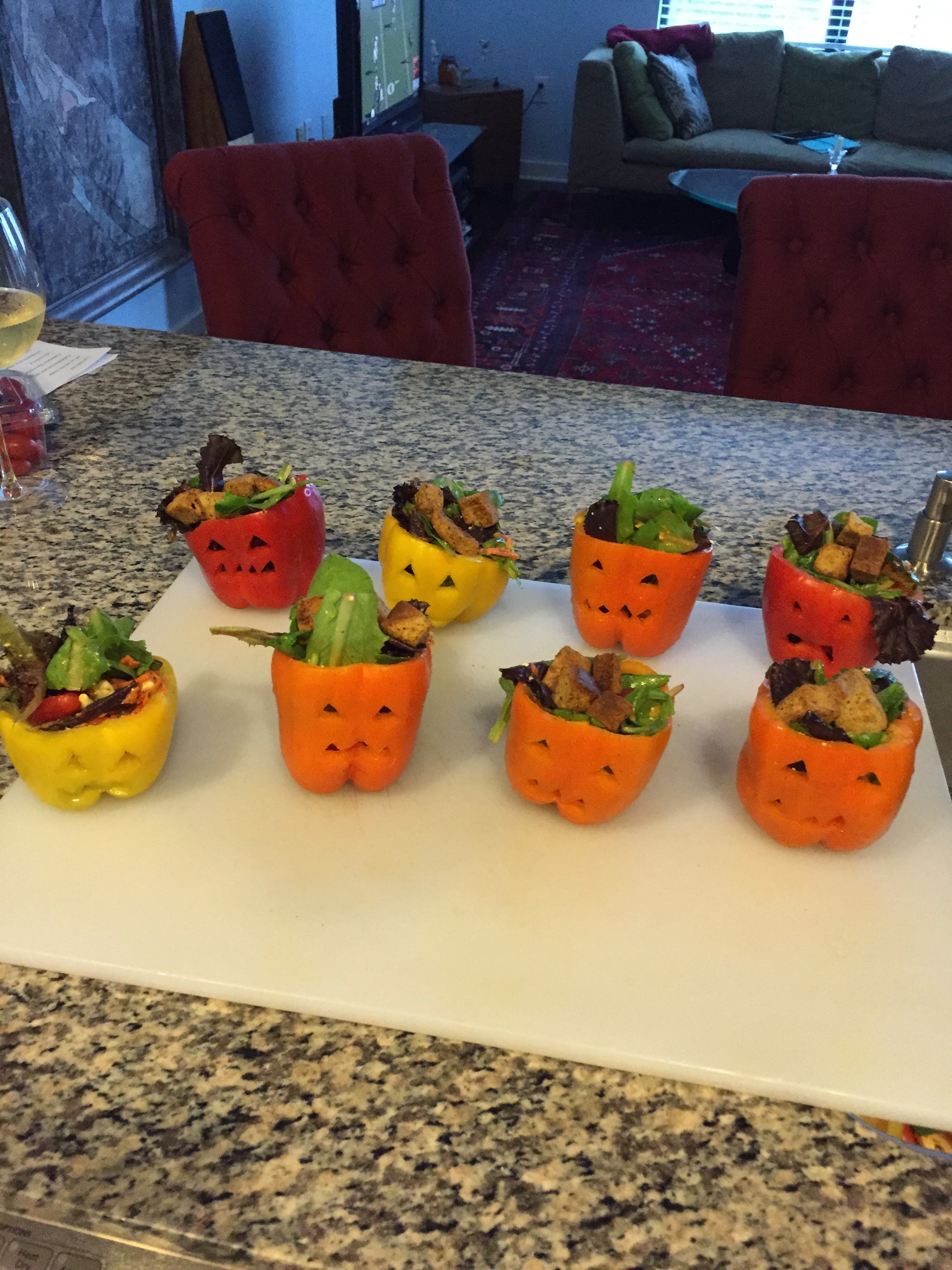 Salads In Carved Out Jack O' Lantern Peppers