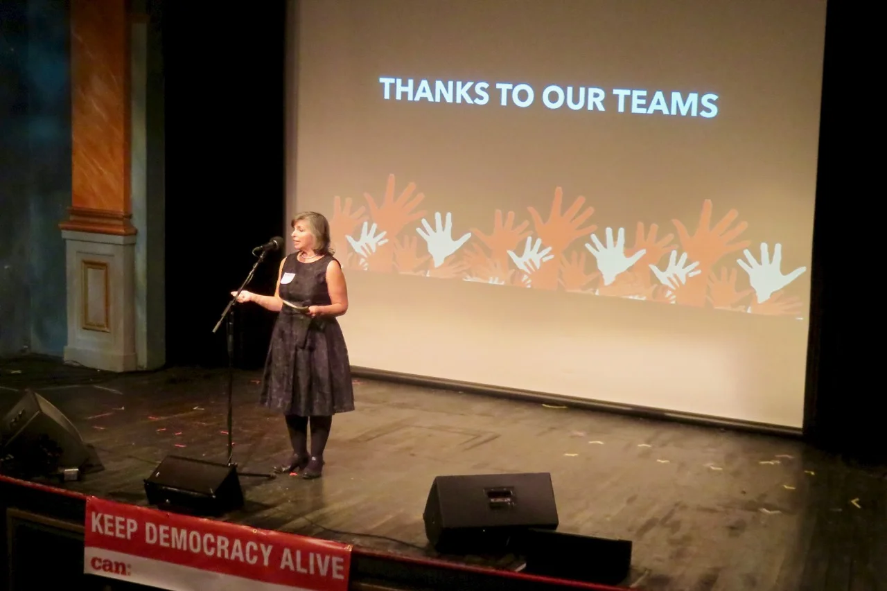 Activist and MVCAN leader Suz Lipman thanks our action teams at the MVCAN-Do-Revue. Photo by George Osner.