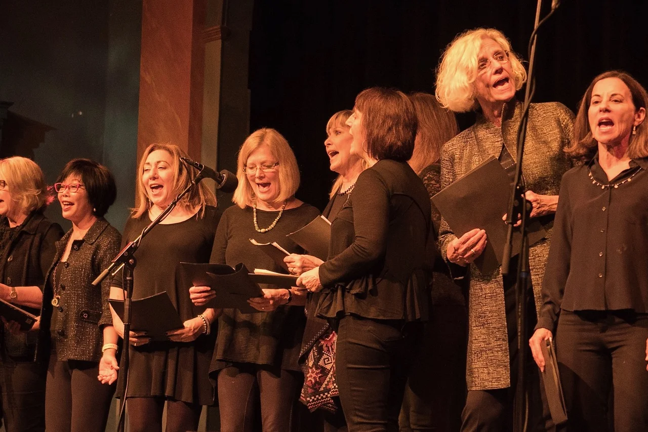 The Shady Ladies sing their hearts out for democracy, led by director Reed Fromer. Photo by Martha Ture.