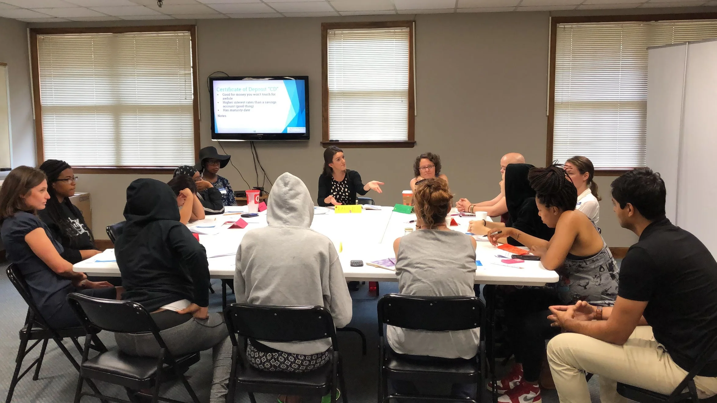 Cymone on the far left during a Financial Wellness session on Banking 1: Basic Accounts