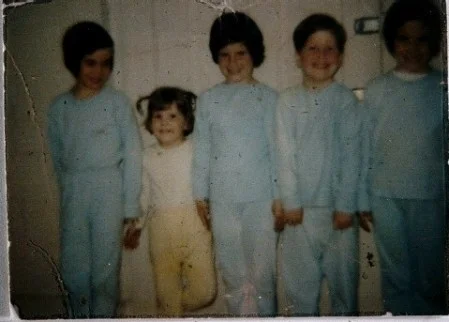 Can't you just feel the energy in his little body? I'm the pigtailed one in yellow. He's the rascal second to the end on the right.