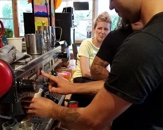 Learning to make coffee drinks at Burde Beans - YPAV social 2018