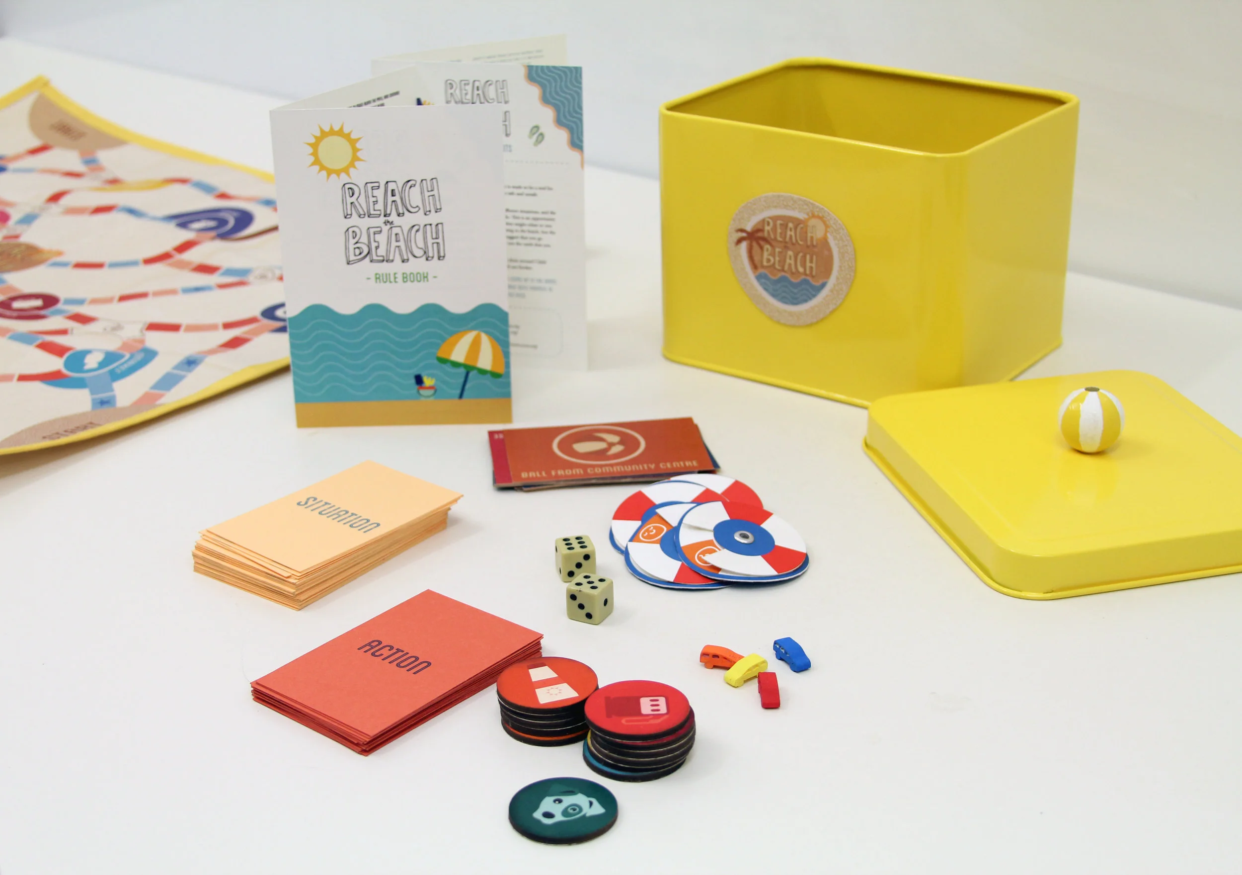 The game includes a Rule Book, situation and action cards, a soft board, dice, reaction cards, tokens and figures. They all come in a metallic box that families can take anywhere they go! 