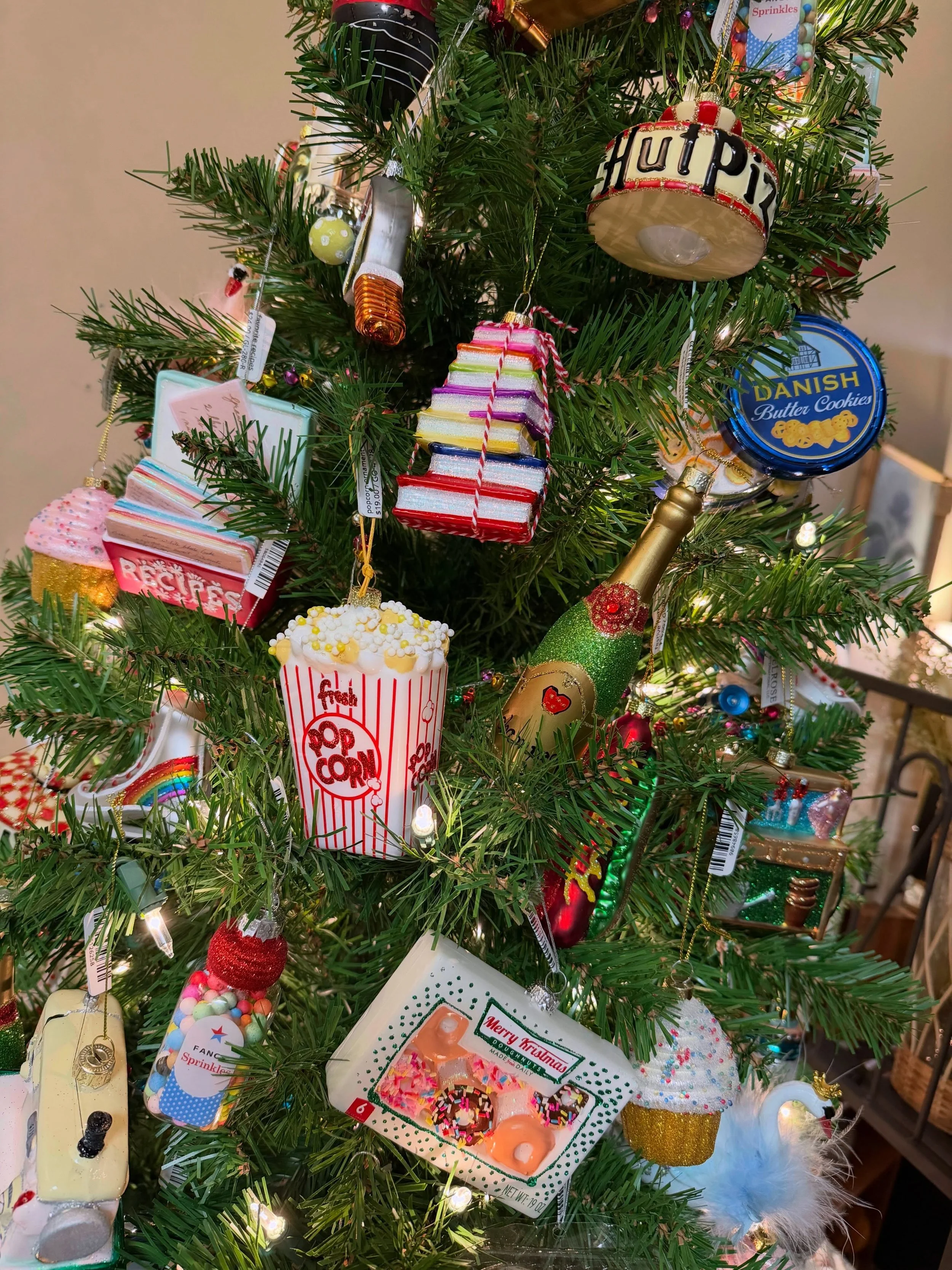 Sewing machines, Pizza Hut lamps, pickleball rackets and Krispy Kreme donuts are just a few of fun ornaments on our eclectic food and hobby tree. Stop by and see the whole collection!
