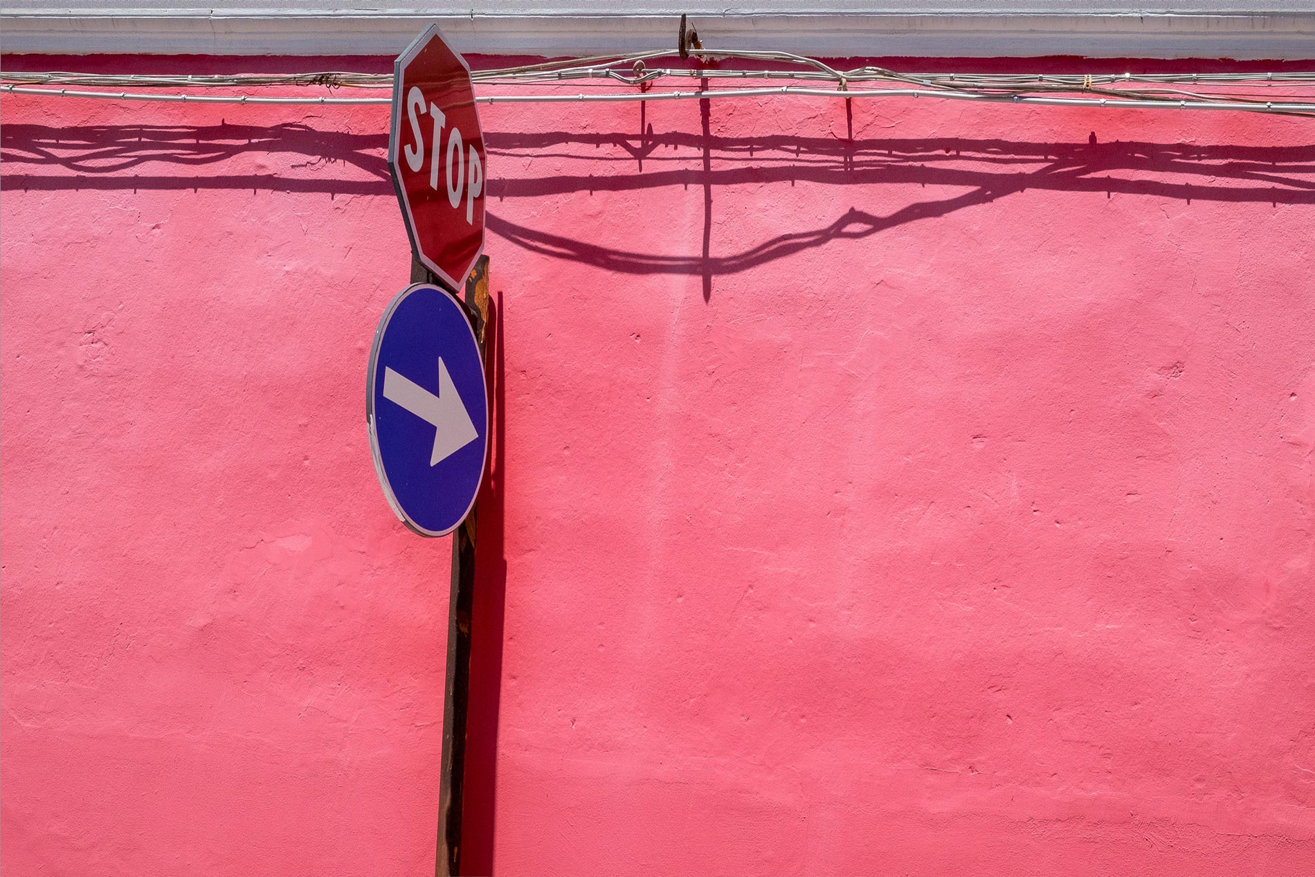 Pink wall and sign - Floridia, Sicily