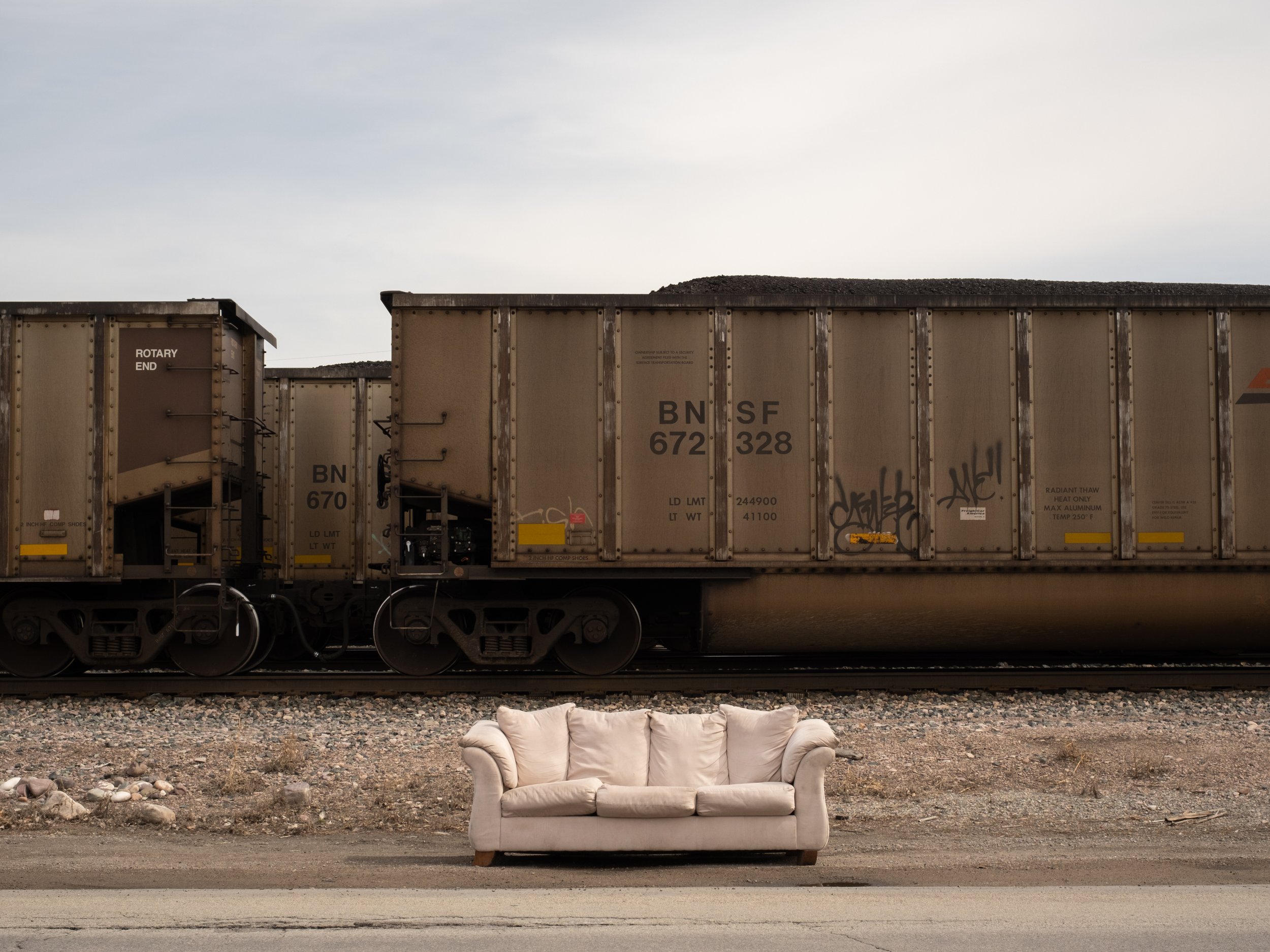 scarfone-white-upholstered-sofa-with-coal-train.jpg