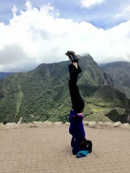 Photo credit: Robert Maschke. Headstand by Yan Maschke on the top of Machu Picchu Peru (8000 feet) in December 2014.