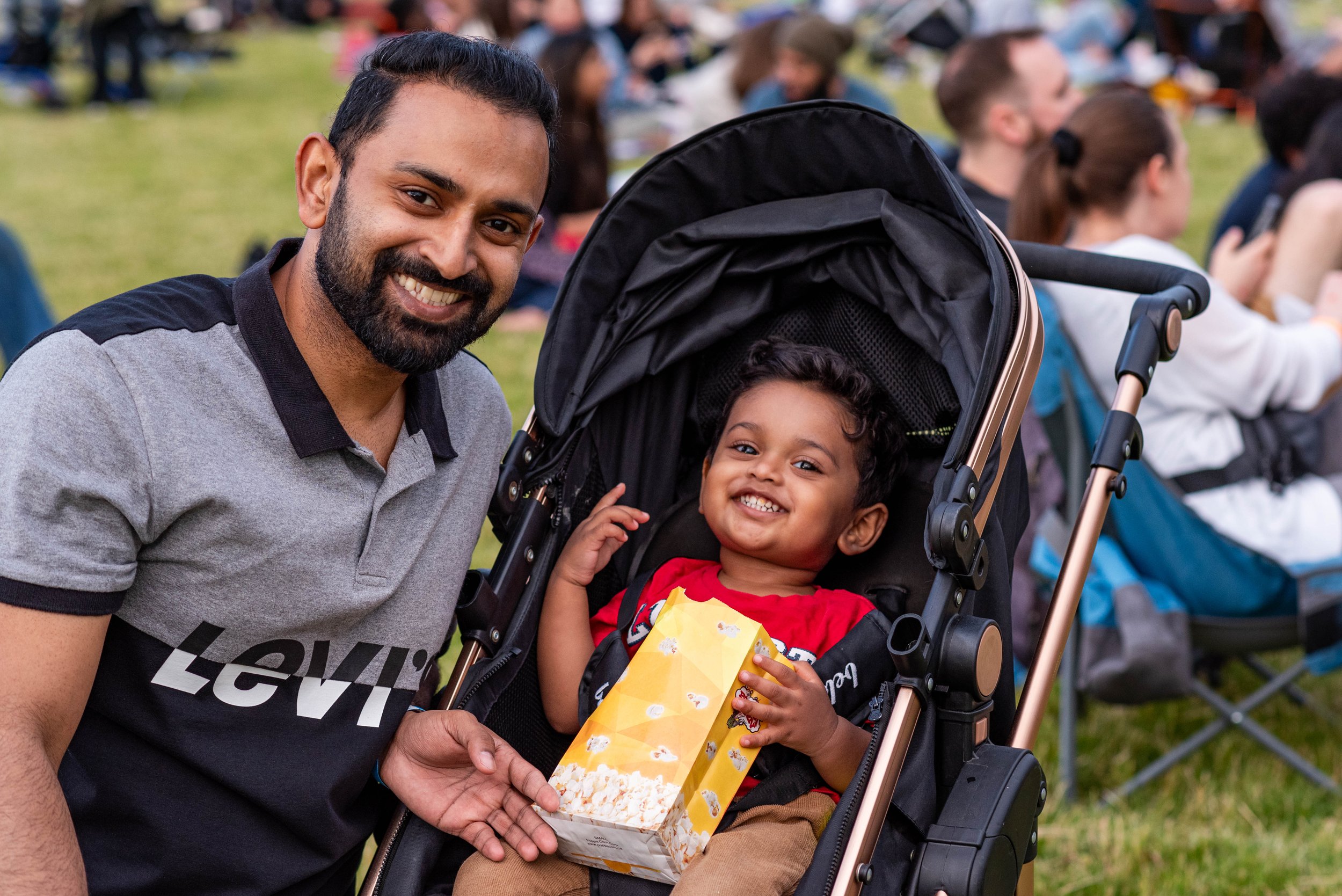  Parent and child enjoy popcorn before the movie begins 