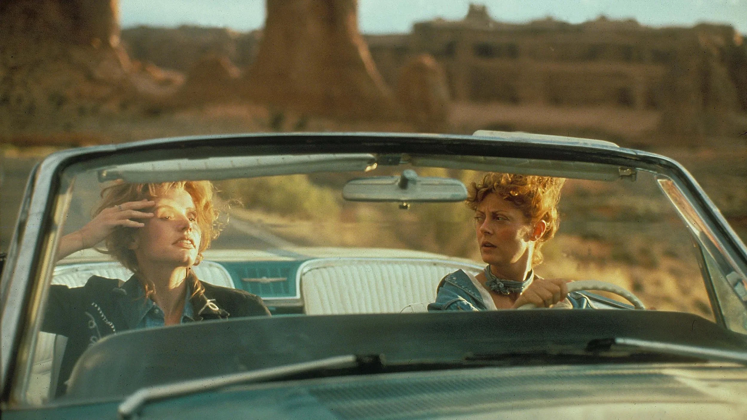 two-women-driving-in-car.jpeg