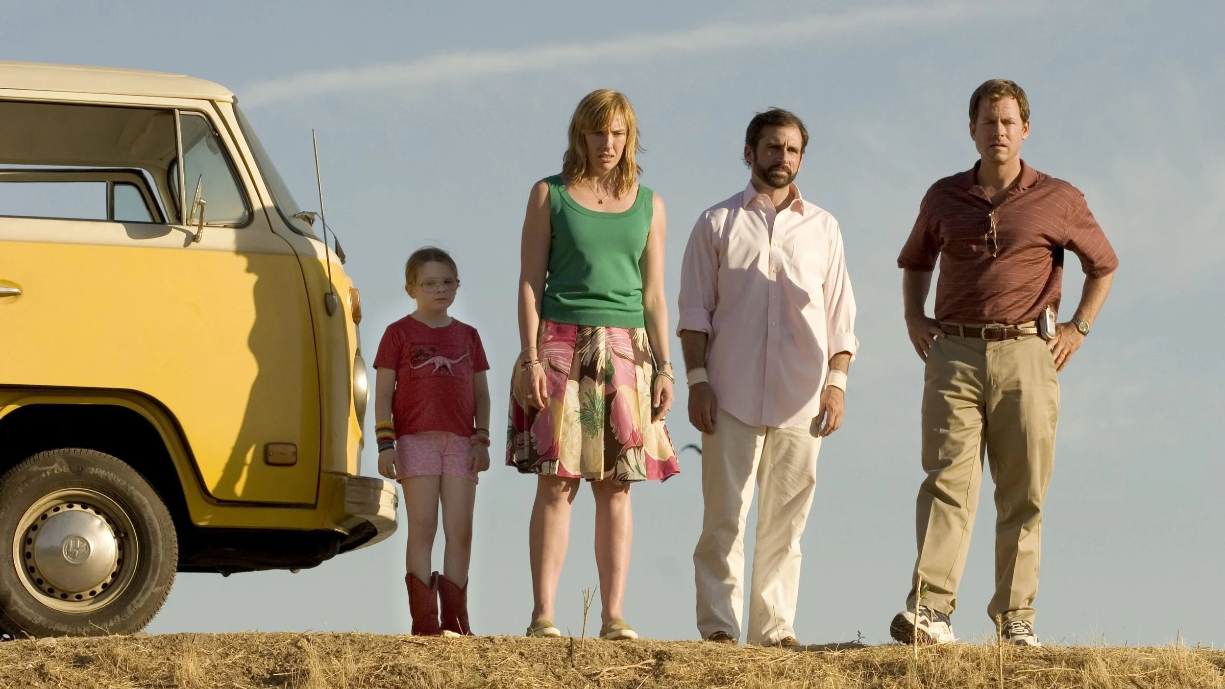 family-standing-beside-yellow-van.jpg