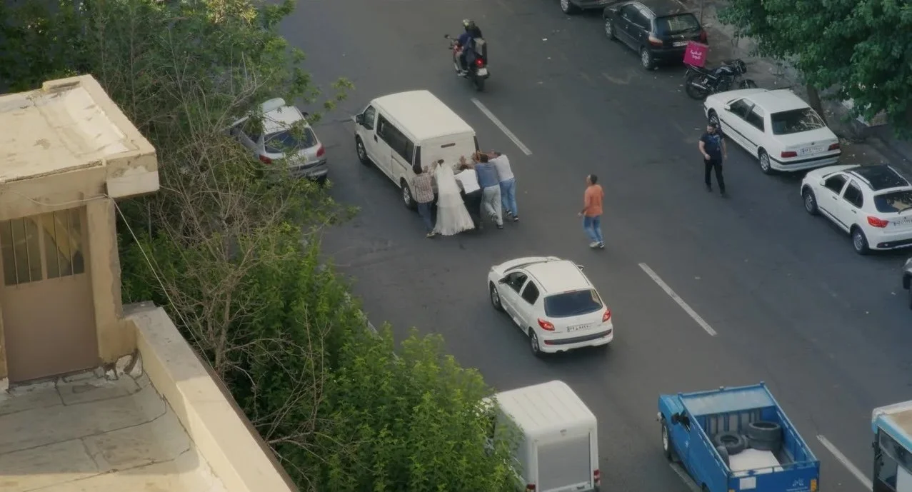 people-pushing-van-on-road.jpeg