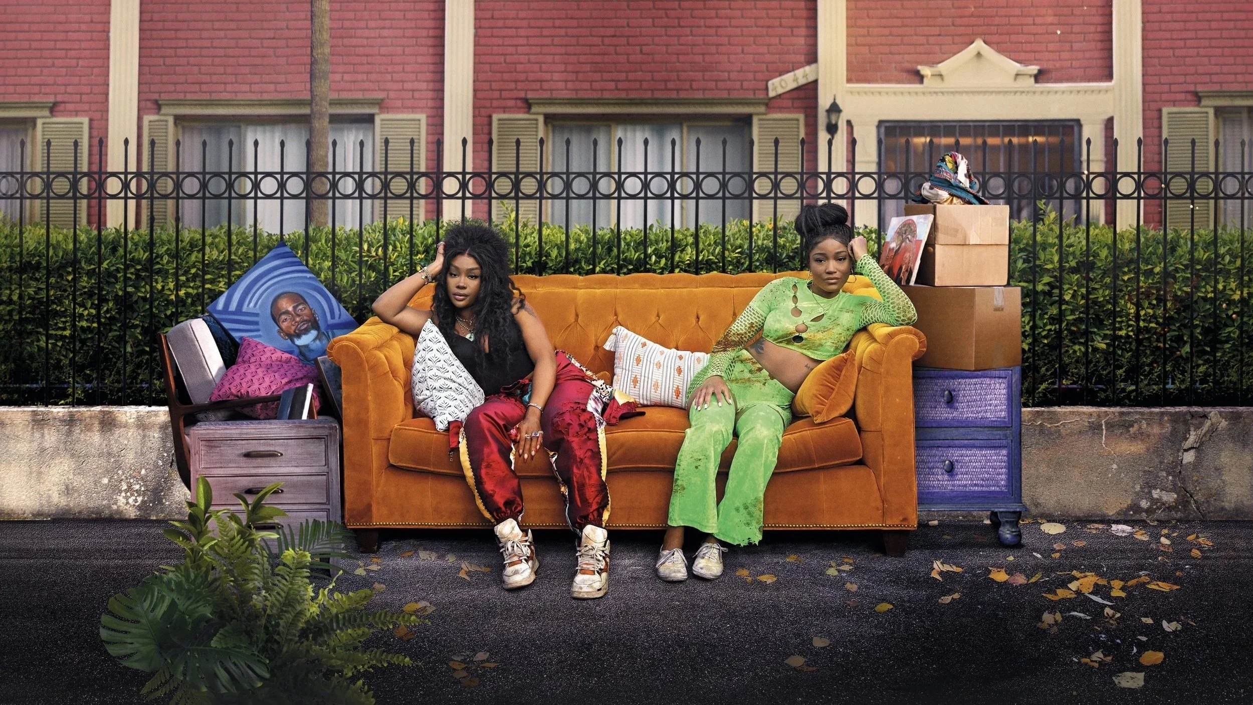two-women-sitting-on-couch-on-street.jpeg