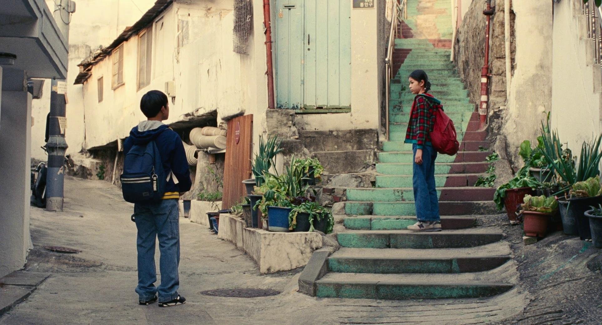 a-girl-on-stairs-looking-at-a-boy.jpg