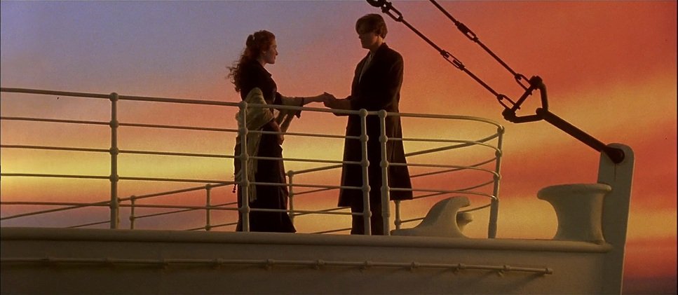 man-and-woman-hold-hands-on-ship-deck.jpg