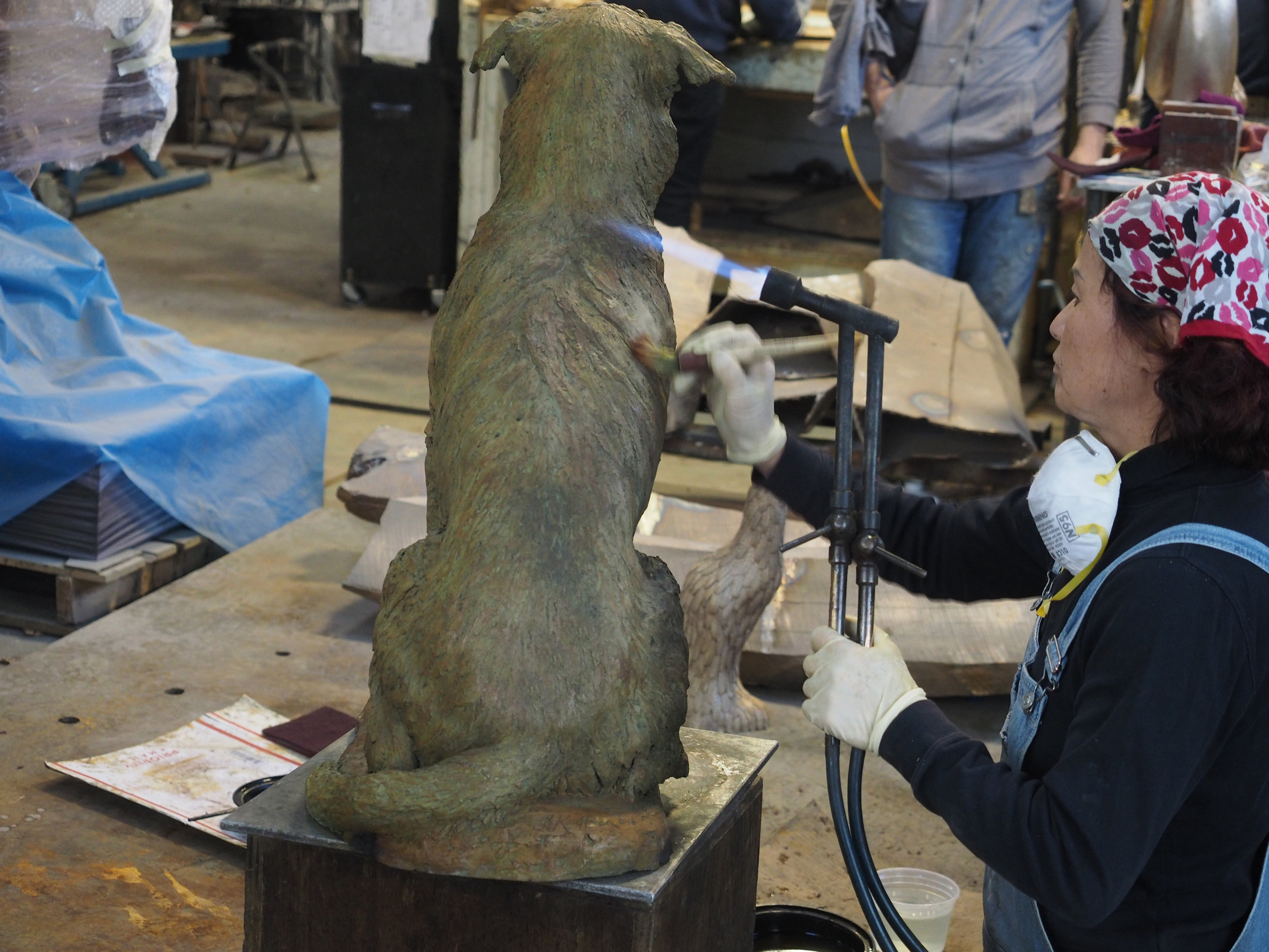  Applying the patina or color. Chemicals are painted on using a blowtorch that heats the metal. 