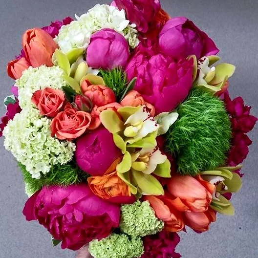 Seasonal and Cheerful Arrangement Adding unexpected textures among seasonal focal floral creates an visually stunning and dynamic composition.