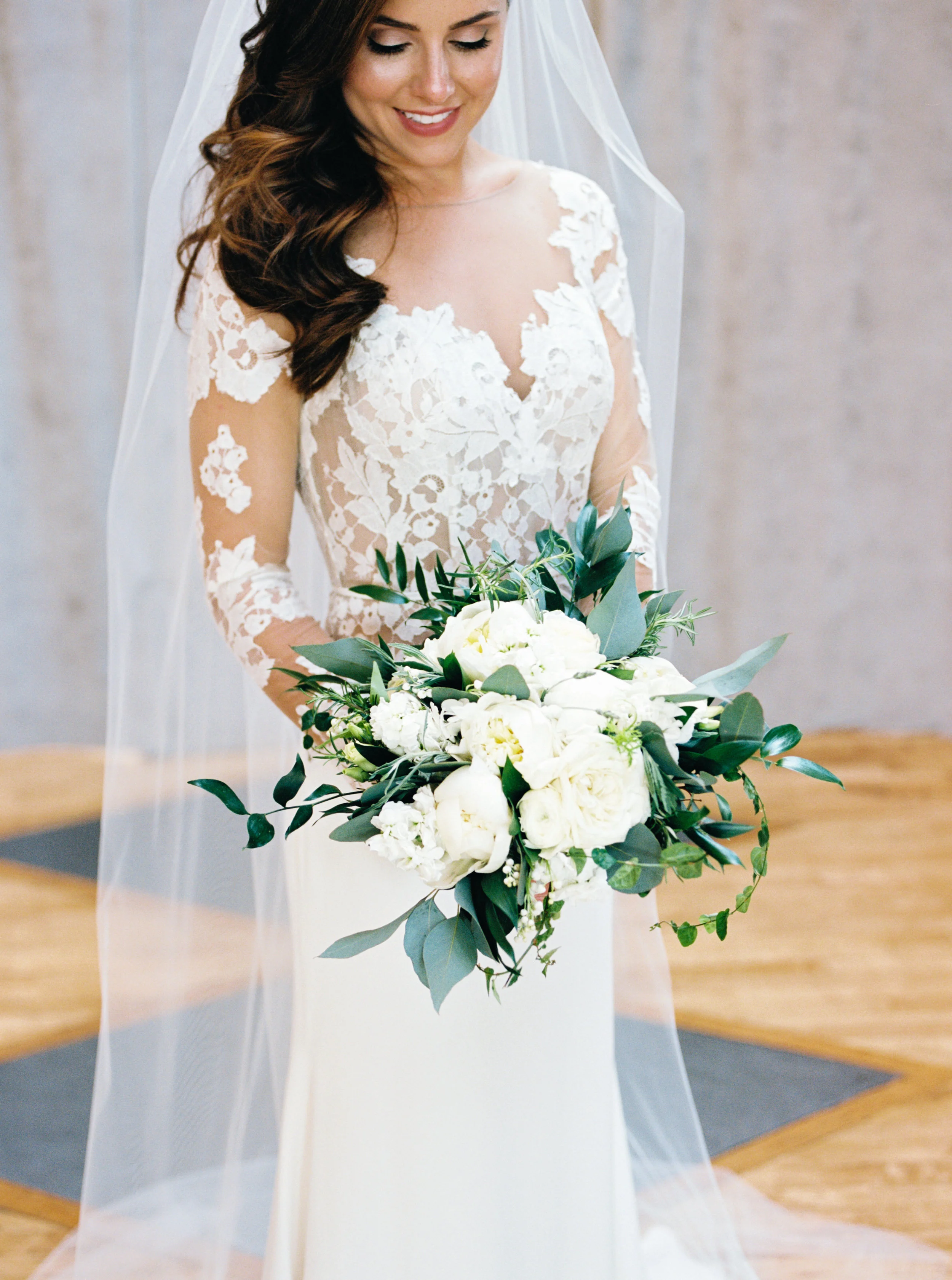 Foliage & Texture Bouquets Traditional Peonies and Lily of the Valley are embellished with textural ivy and eucalyptus greens. This loose arrangement is a perfect combination of traditional and contemporary. Photo Credit: Dabble Me This Photography Venue: Bridgeport Art Center