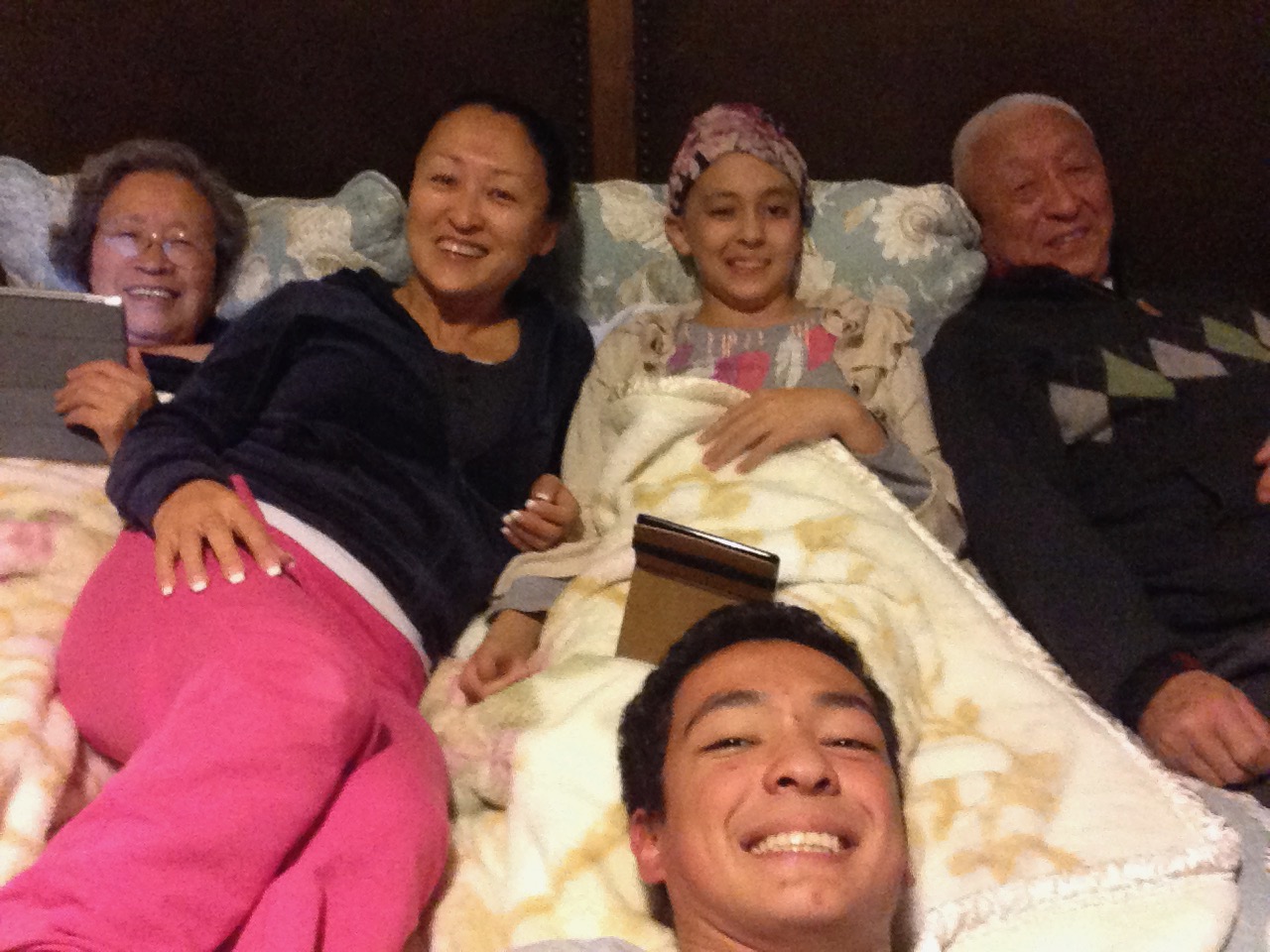 Our whole family in bed after Noah was discharged, though she was still going through Chemotherapy at the time.