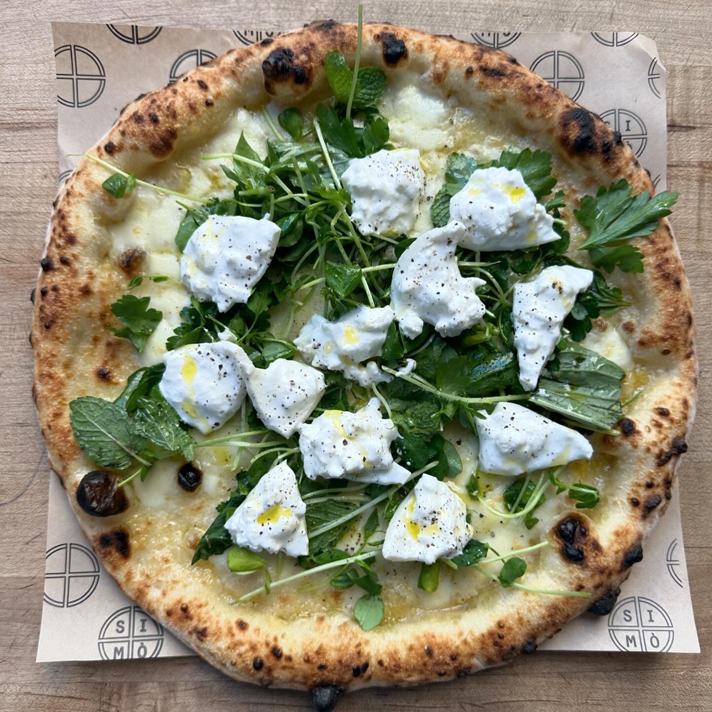 Have you tried our Pizza Primavera yet? With a &ldquo;base bianca&rdquo; (which is a &ldquo;white base&rdquo; meaning that there is not tomato sauce) this special pizza of the month features the best of the season, such as spring pea shoots, mint and