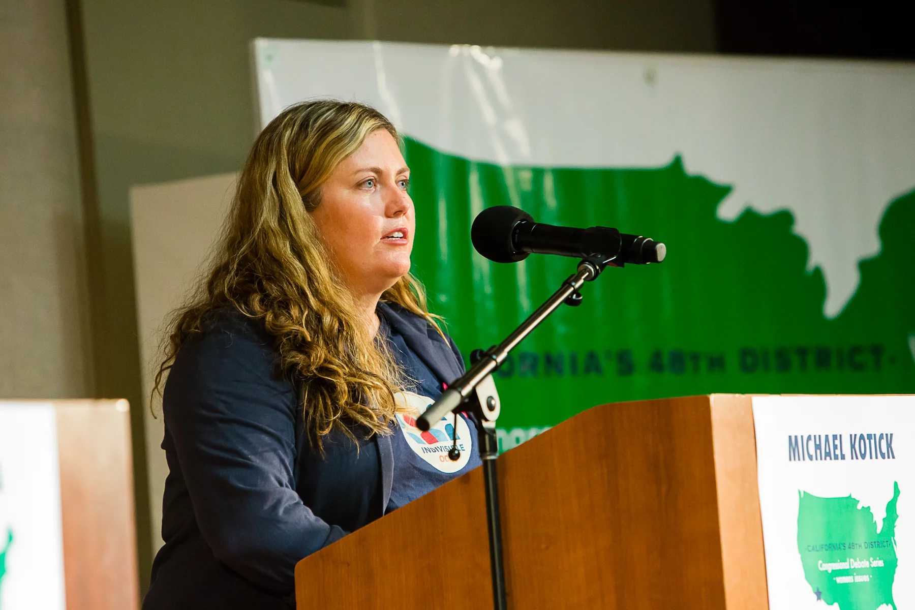 1133_180403 IndivisibleOC48 Debate2-4x6.jpg