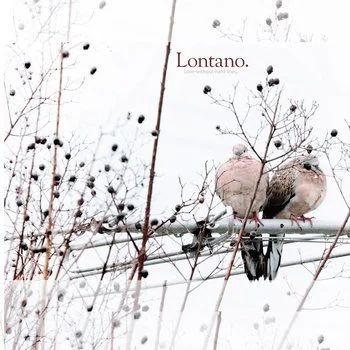 Two birds perched on a wire surrounded by snow-covered branches and twigs.