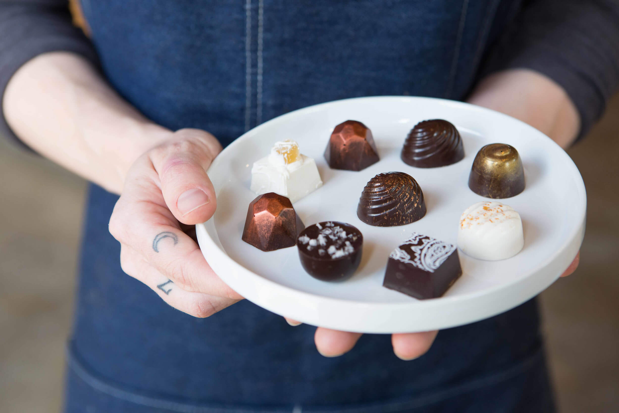 krystal holding plate of chocolates
