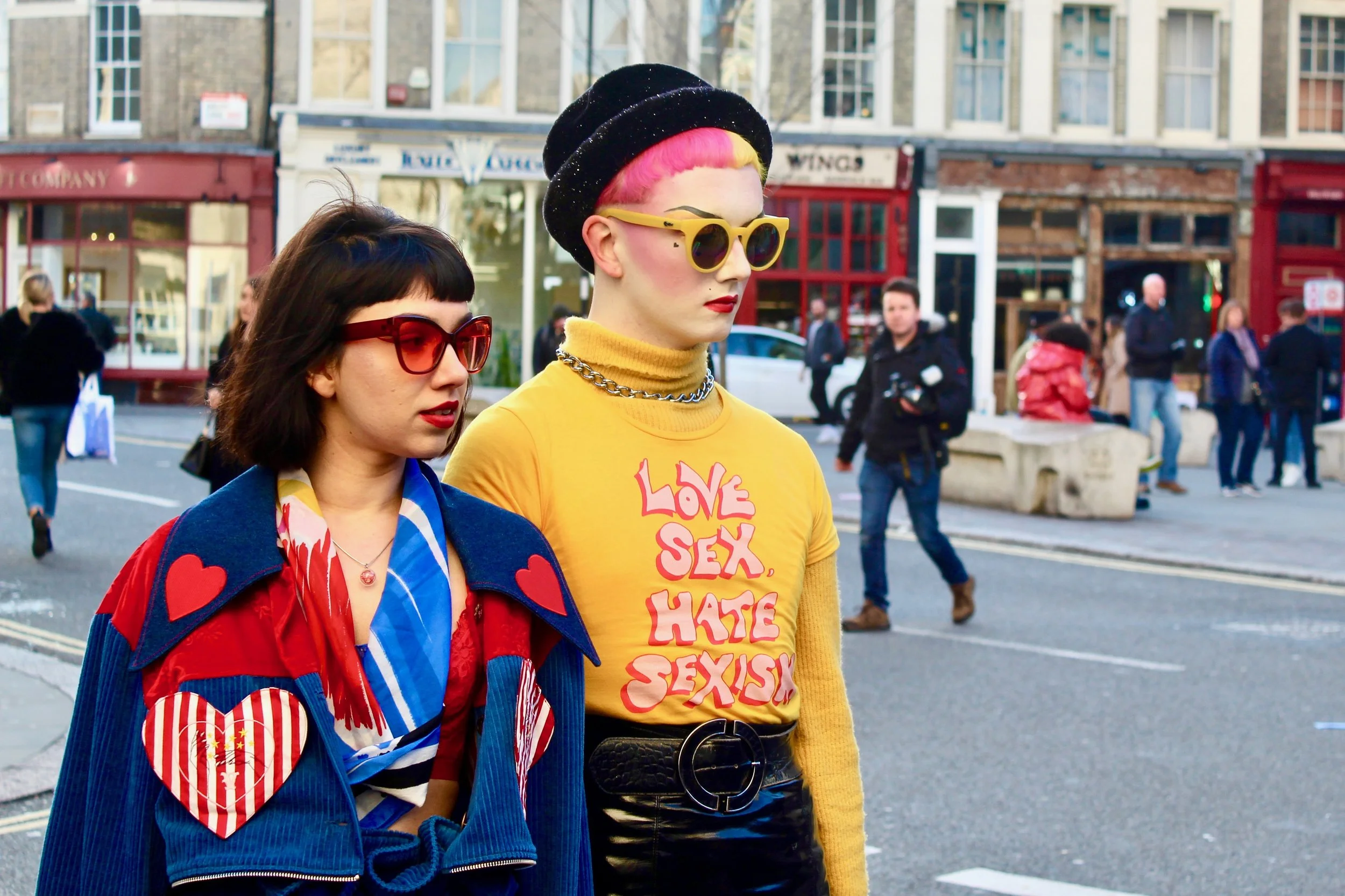 Feminist Fashionistas posing outside the venue