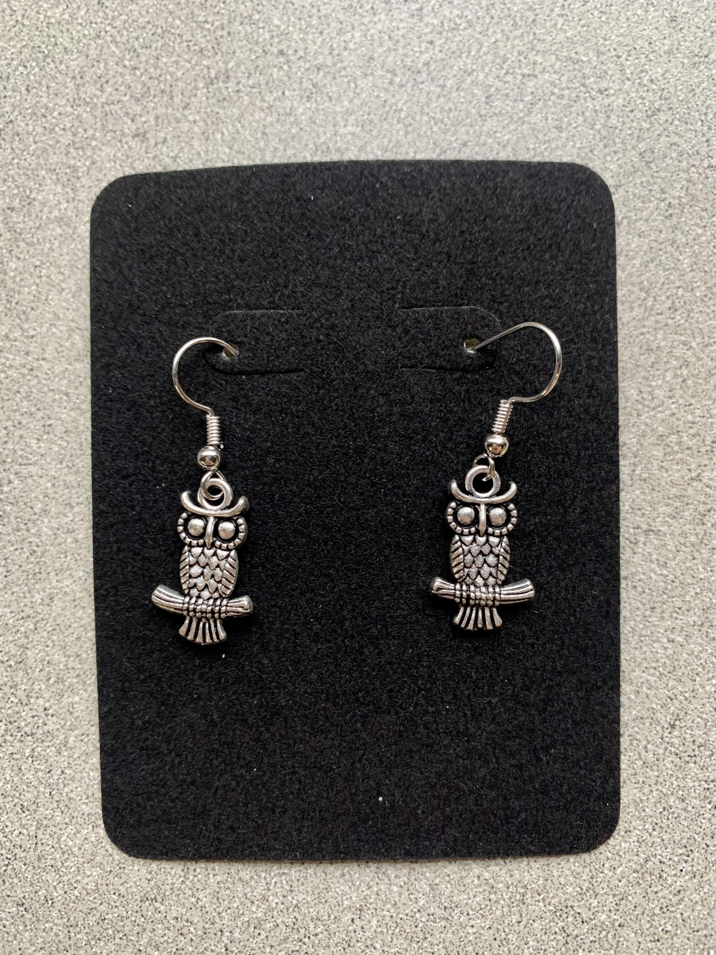 Silver perched owl.jpeg