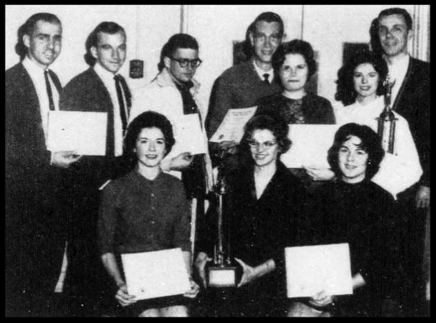 1962-1963 Florida State Debate Team Holding Awards from the West Georgia Tournament