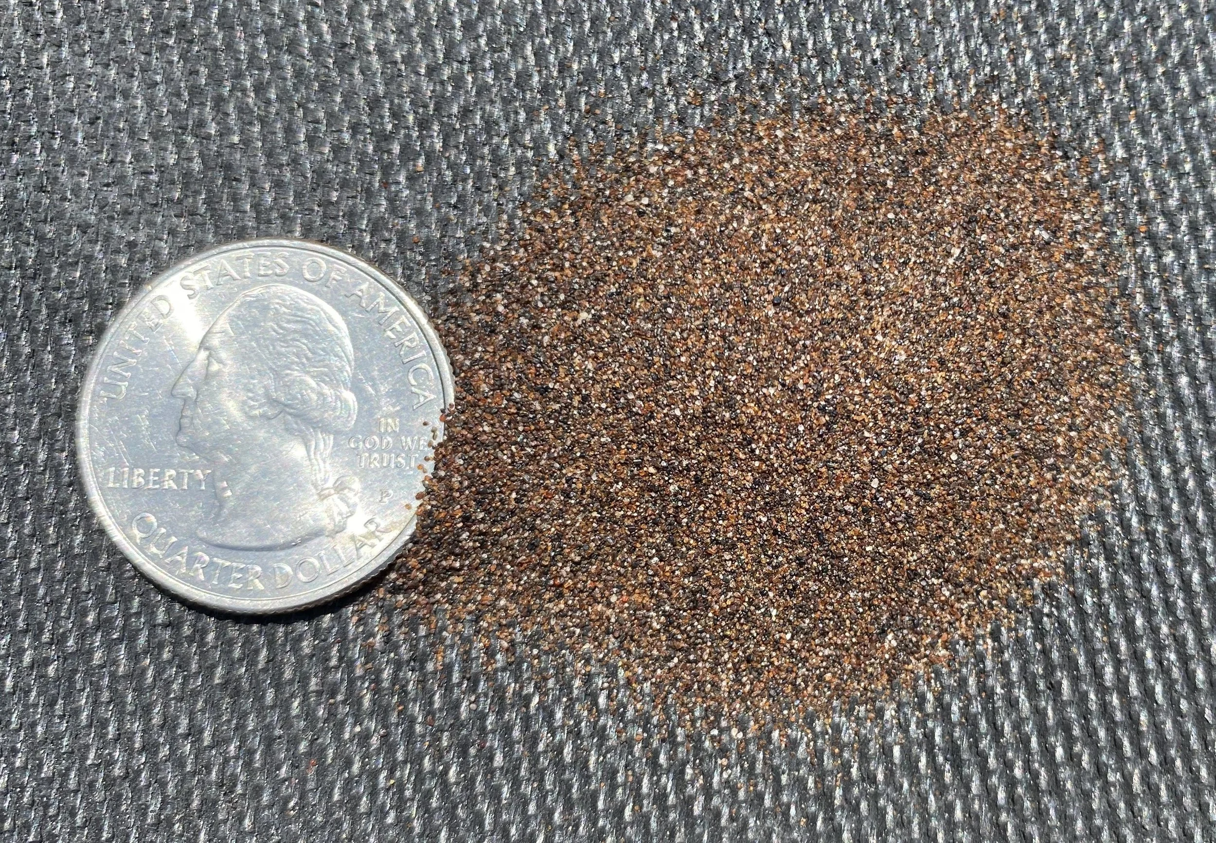 Spex•Lite® Heavy Sand_Quarter Comparison_Black Backdrop.jpg