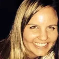 Close-up photo of a smiling woman with long, light brown hair and light skin.