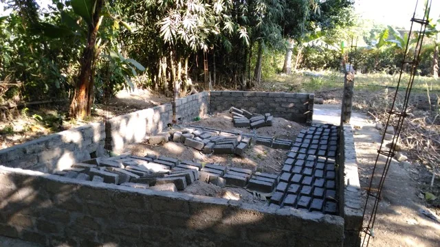 Construction on Ajit's new pigpen.