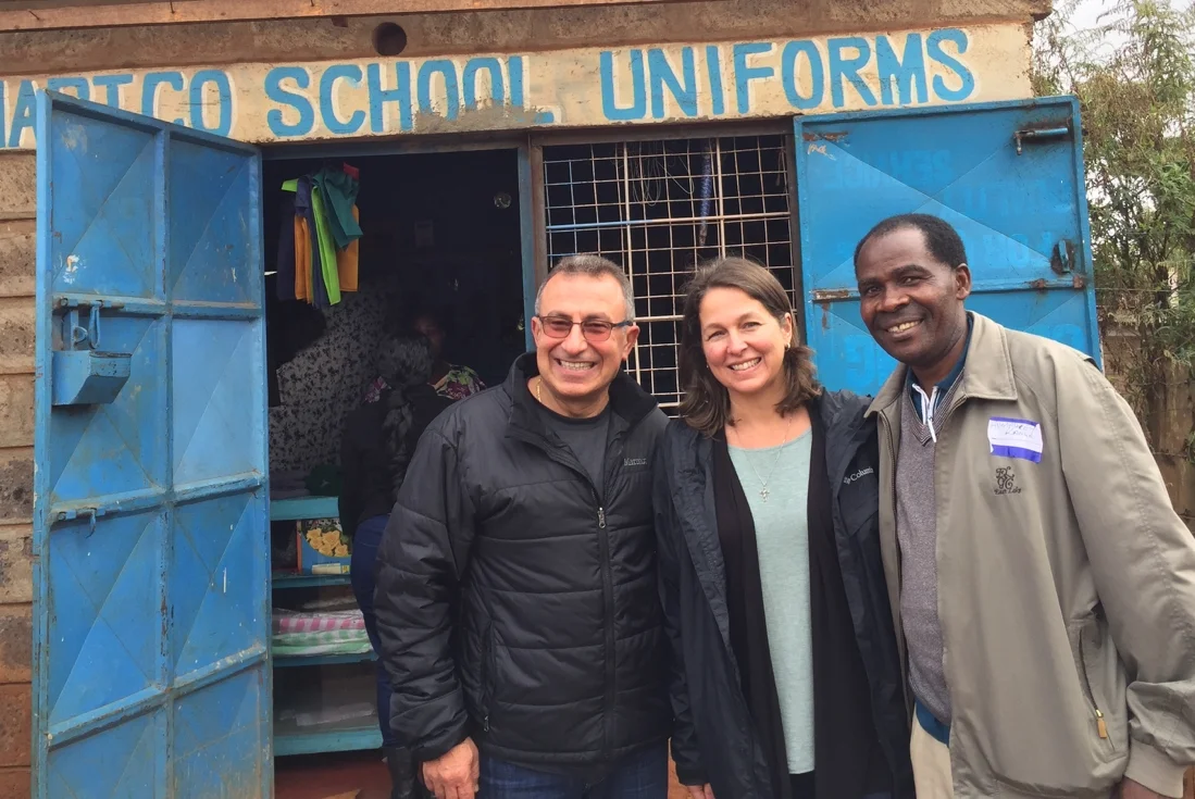 Humphrey Kanga (right) with TOLI Founder Emad Yassa (left) and Executive Director Abigail McConnell (center) visiting a client's business in Kenya.