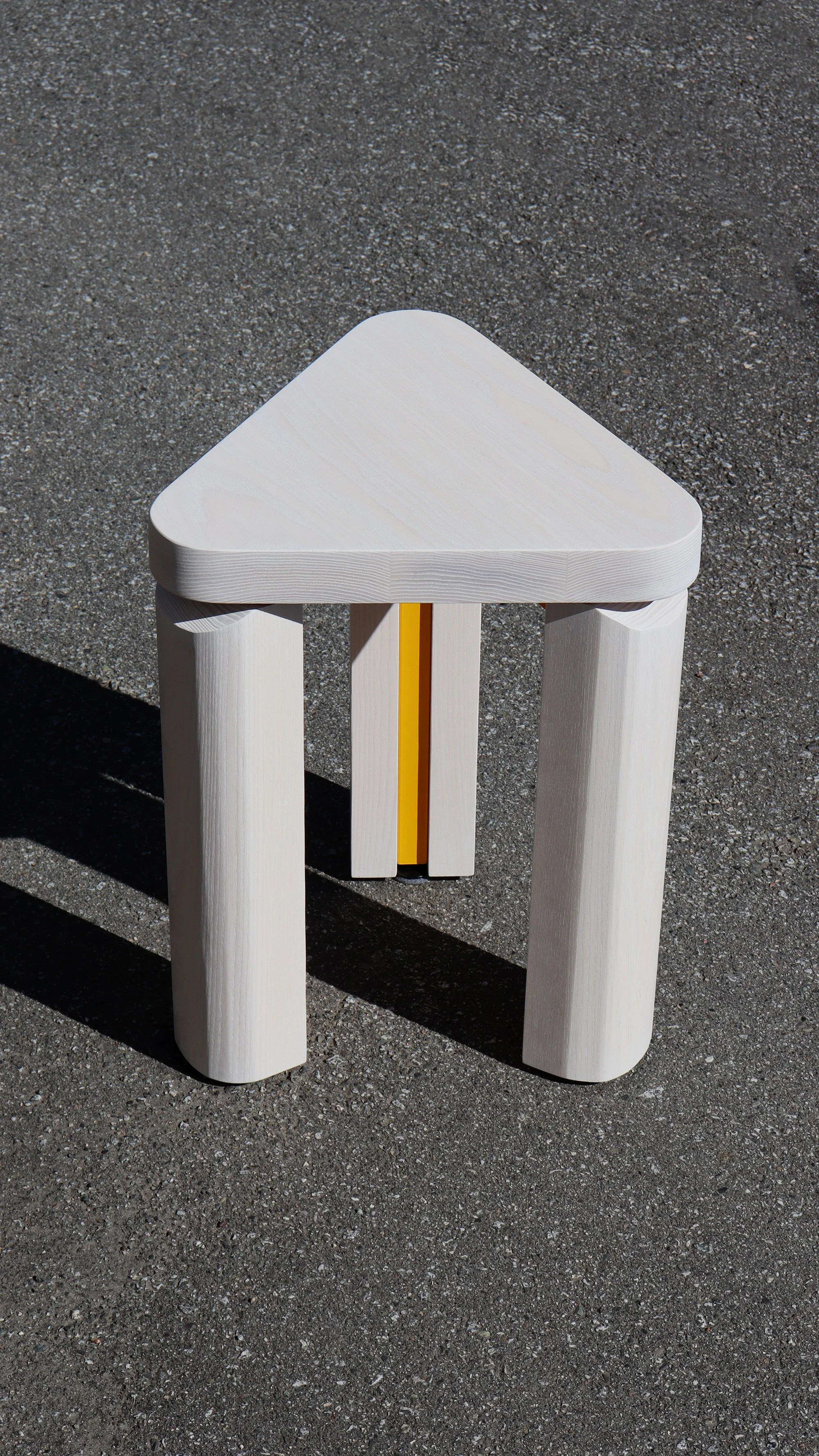 yellow stool concrete.jpg