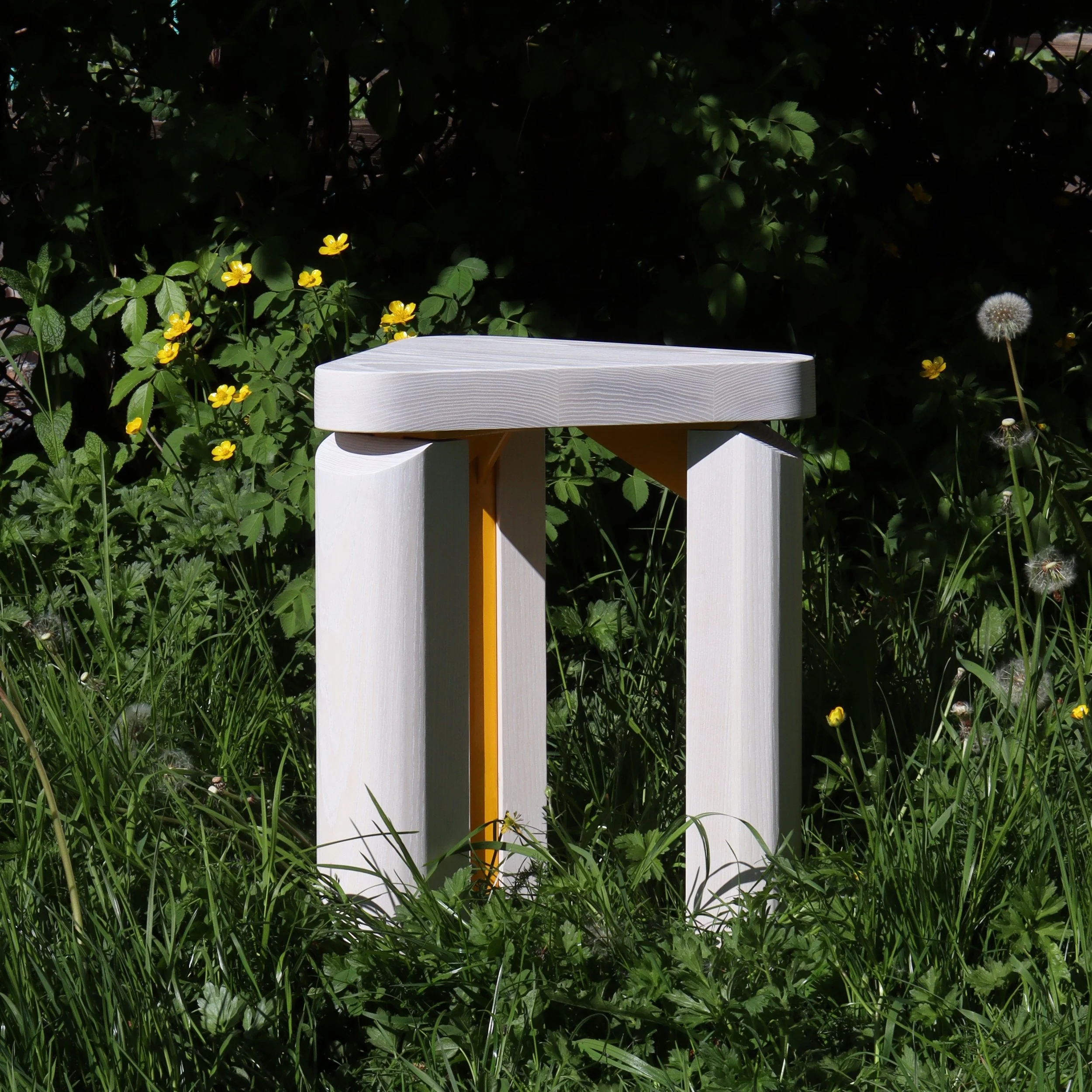 yellow stool square grass.jpg