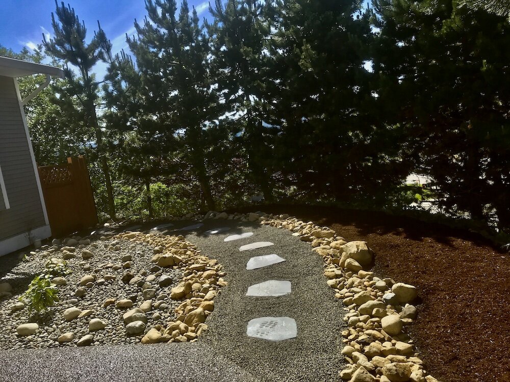 river rock and slate walkway with pea gravel