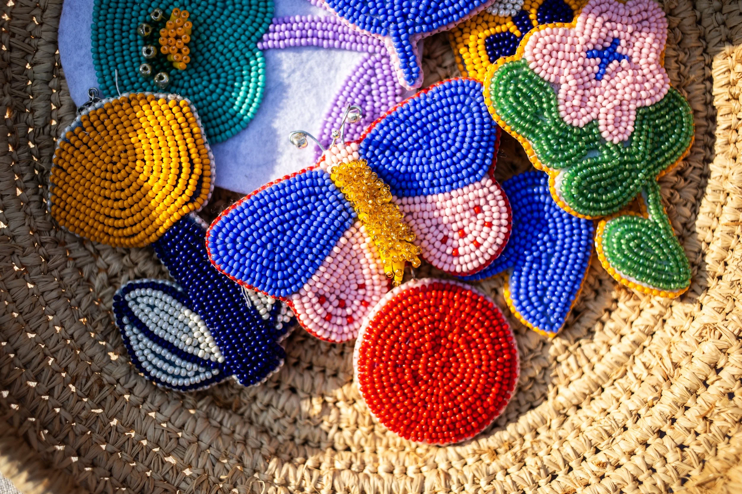 One of a kind large beaded earrings in a basket